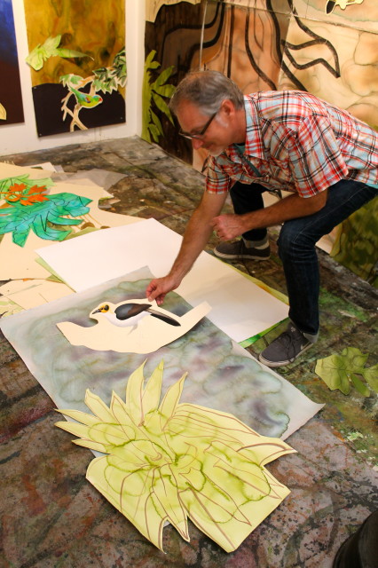 Photo of David Tomb working on a collage